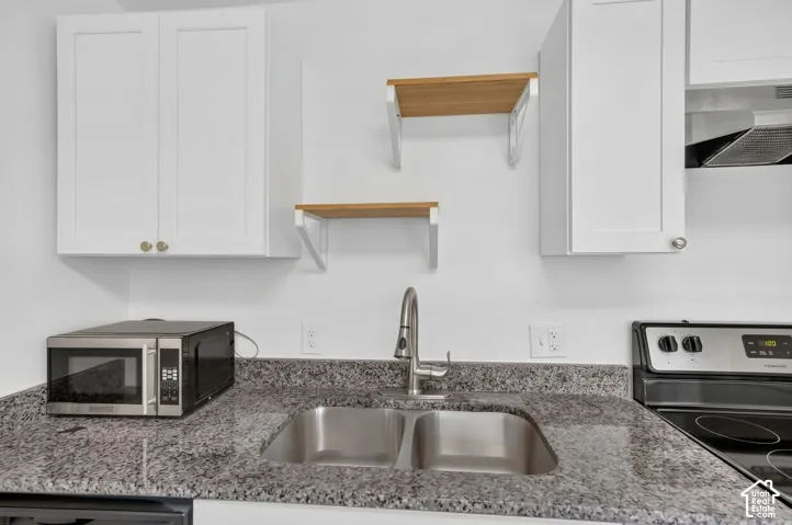 Updated kitchen with granite countertops and fresh paint
