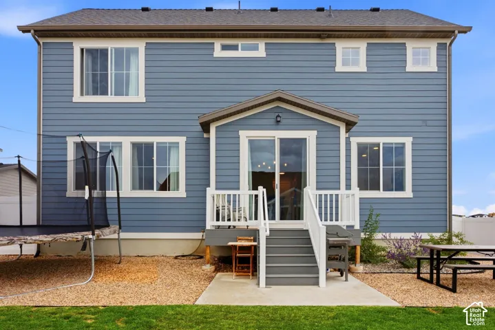 Blue horizontal siding exterior with white window trim