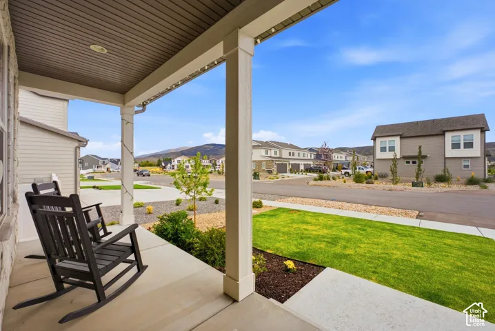 Covered front porch with recessed lighting