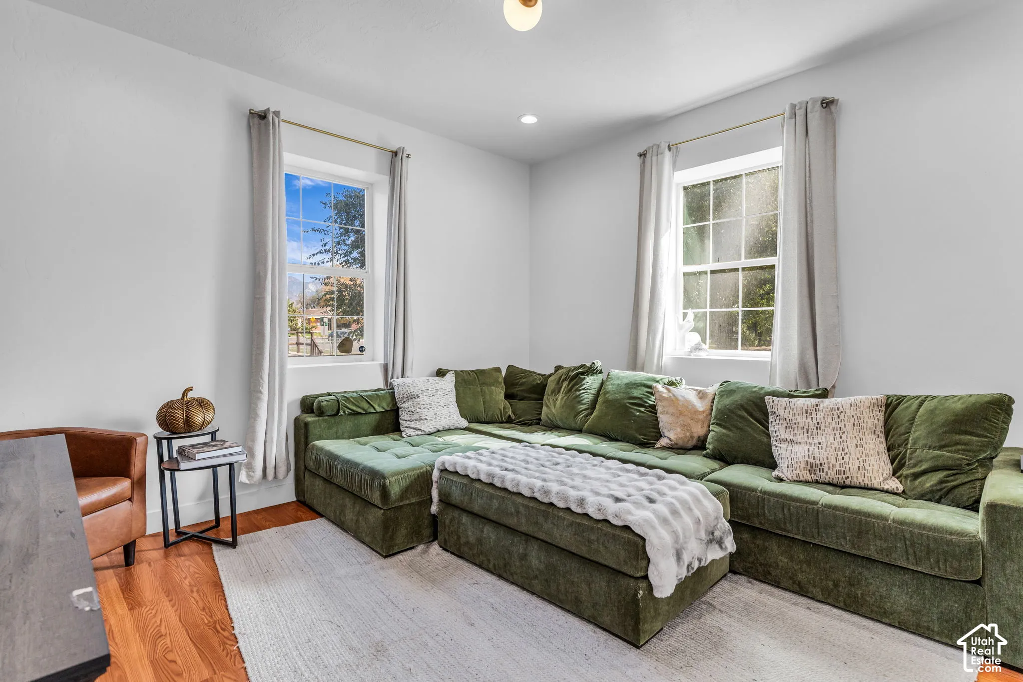 Recessed lighting and a single flush-mount ceiling fixture illuminate the space