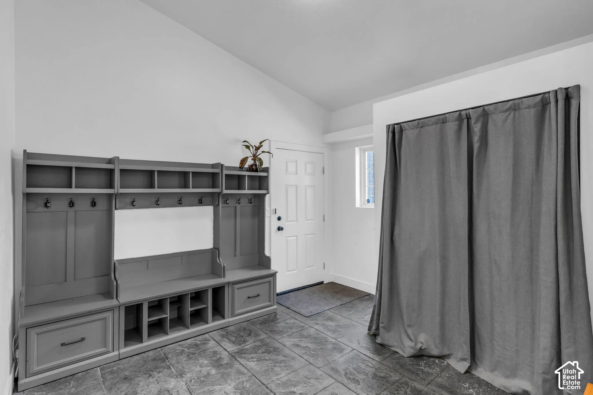Built-in hall tree with integrated storage, hooks, and bench seating