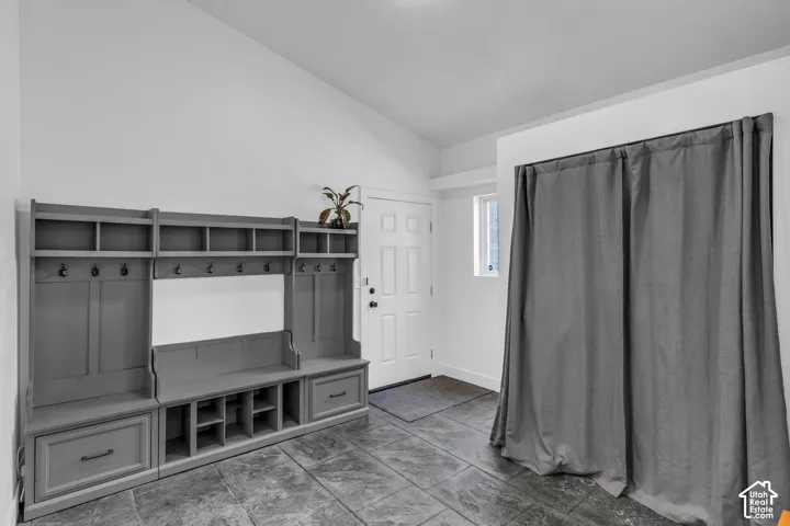 Built-in hall tree with integrated storage, hooks, and bench seating