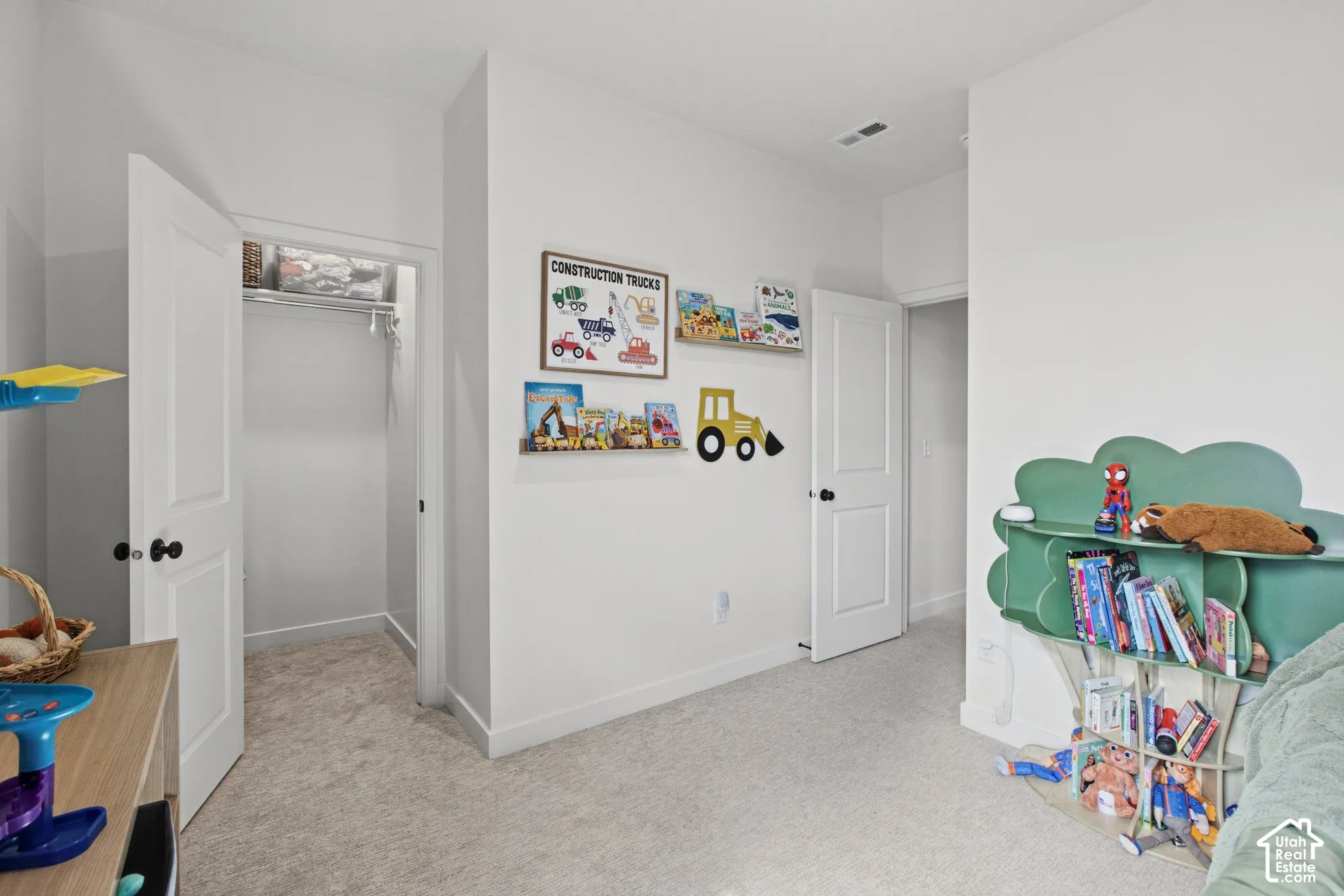 Wall-to-wall carpeting and white interior doors with black hardware