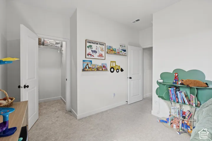 Wall-to-wall carpeting and white interior doors with black hardware