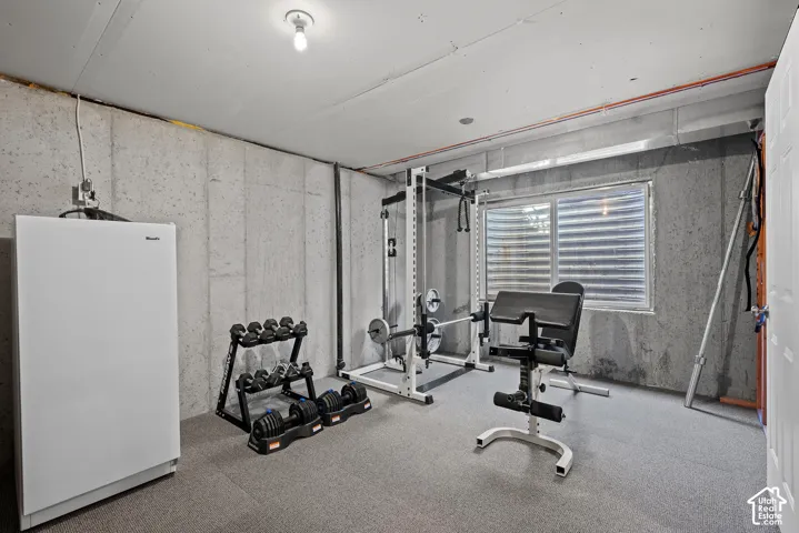Concrete foundation walls with exposed conduit and utility lines