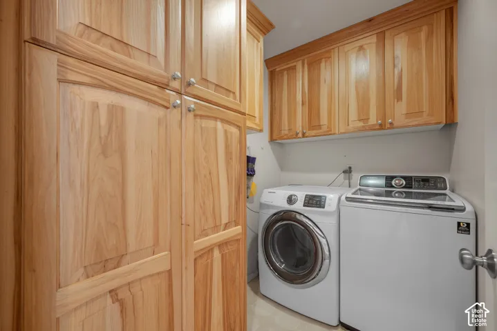 Full-height wood-finish cabinetry, upper wood-finish cabinetry, and neutral wall color