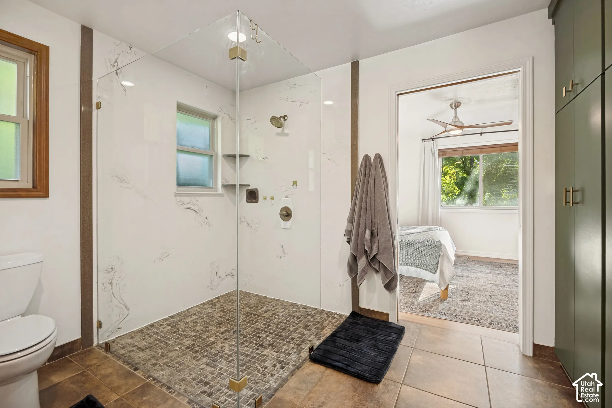 Primary bathroom with shower, freestanding tub, and dual vanities
