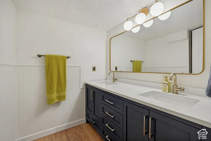 Full basement bathroom with dual vanities