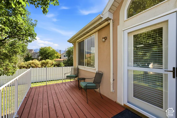 Wood deck off of main floor great room with white railing