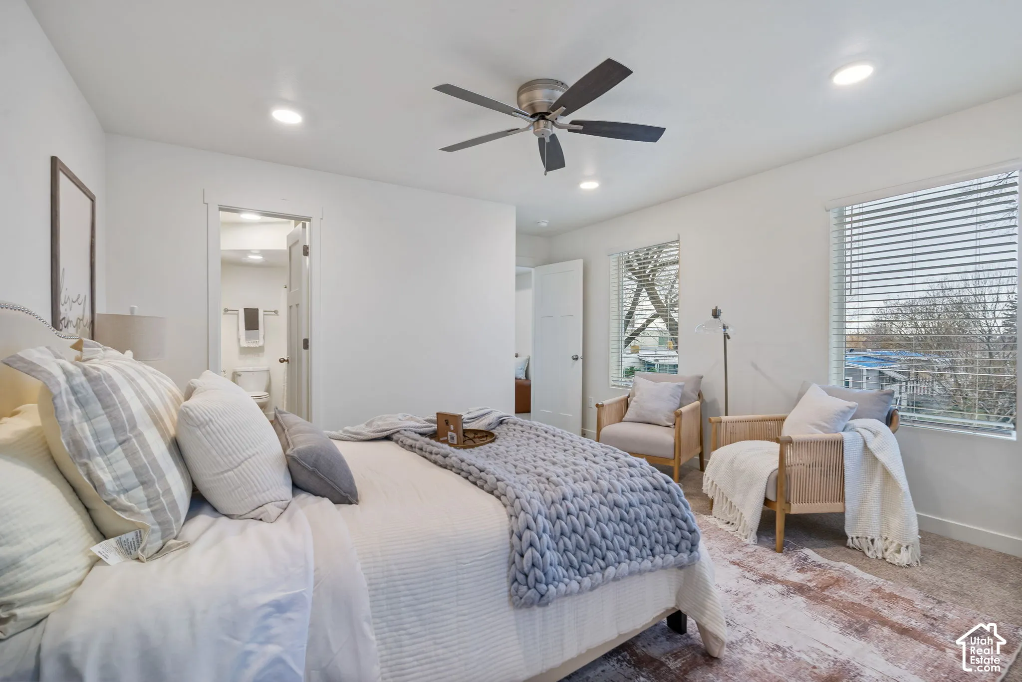 White walls with recessed lighting and a ceiling fan