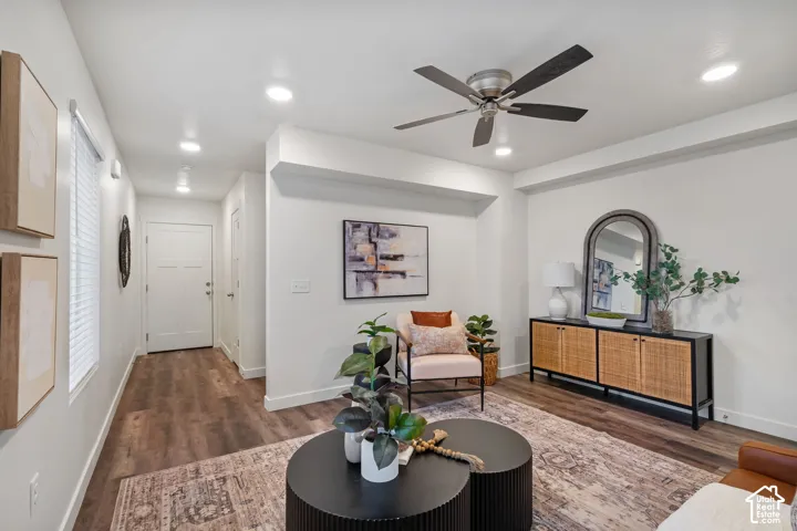 Recessed lighting, wood-finish flooring, a ceiling fan, and white paneled doors