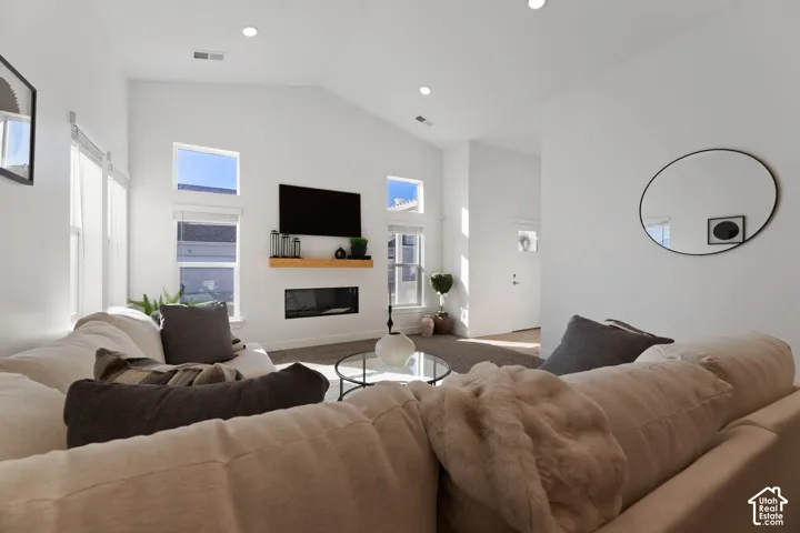 11' High Vaulted ceilings with recessed lighting with lots of light