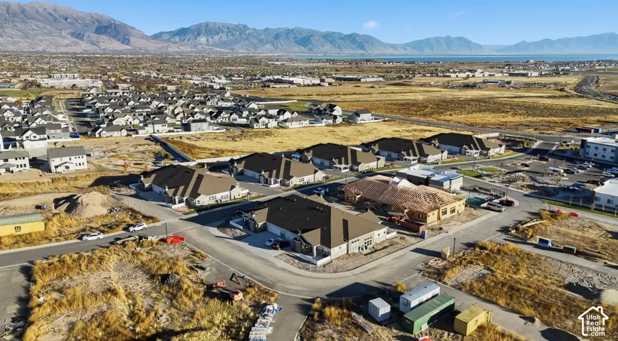 Expansive residential development with mountain backdrops and Utah Lake nearby