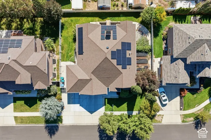 Asphalt shingle roof with multiple solar panel arrays