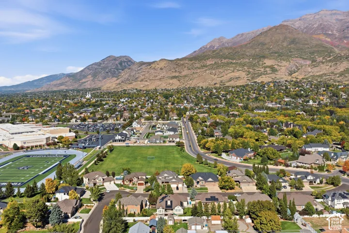 Expansive mountain backdrop with a dense residential area