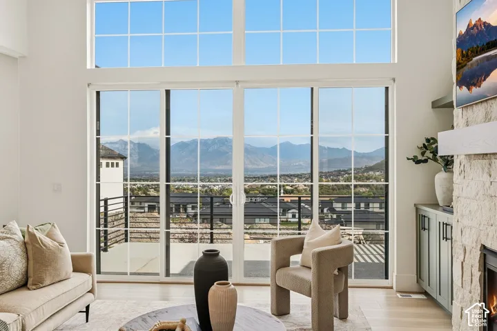 Expansive windows and oversized slider doors frame incredible mountain views and a deck to take it all in.