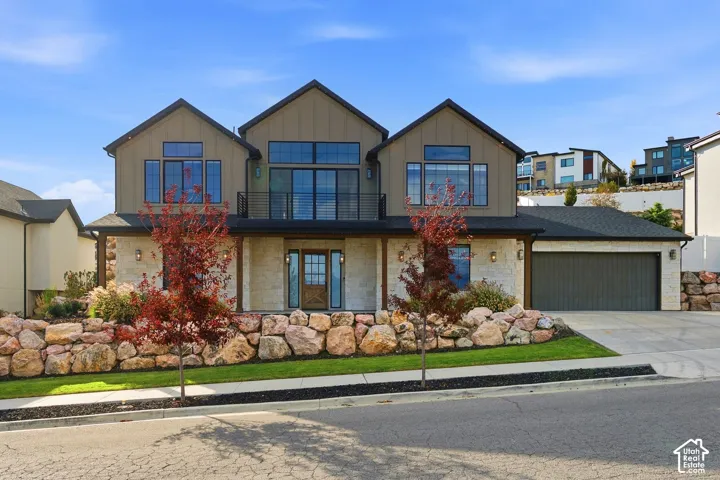 Street view of home featuring beautiful exterior finishes and grand windows