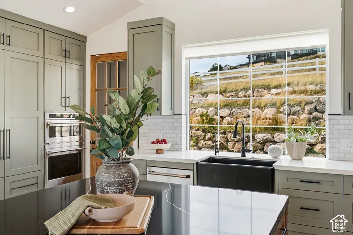 Kitchen farmhouse style sink and big windows.