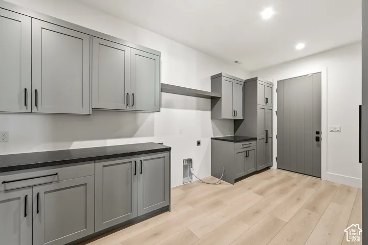 Laundry room equipped for a gas or electric dryer.