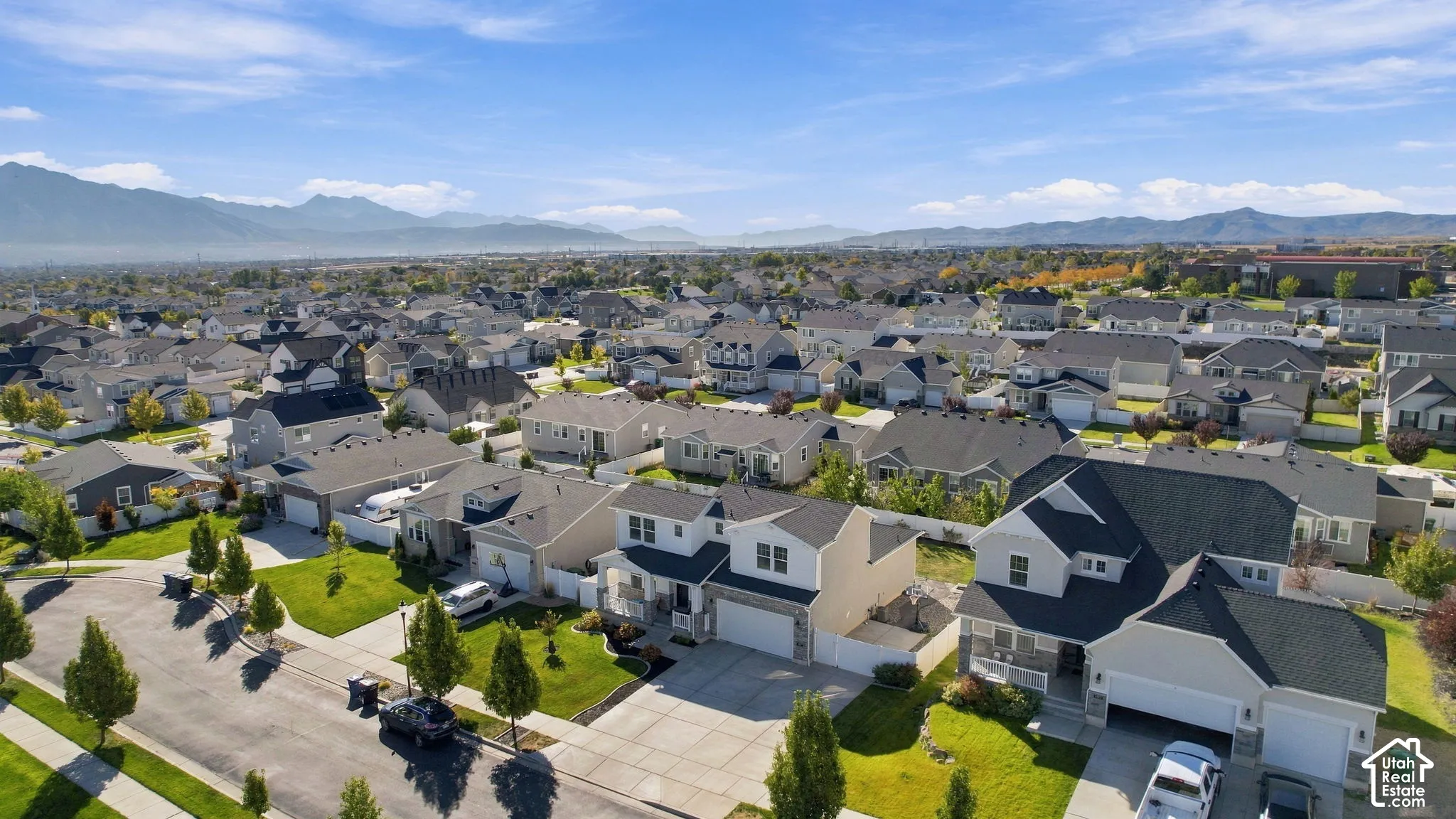 Residential neighborhood with single-family homes and mountain backdrop