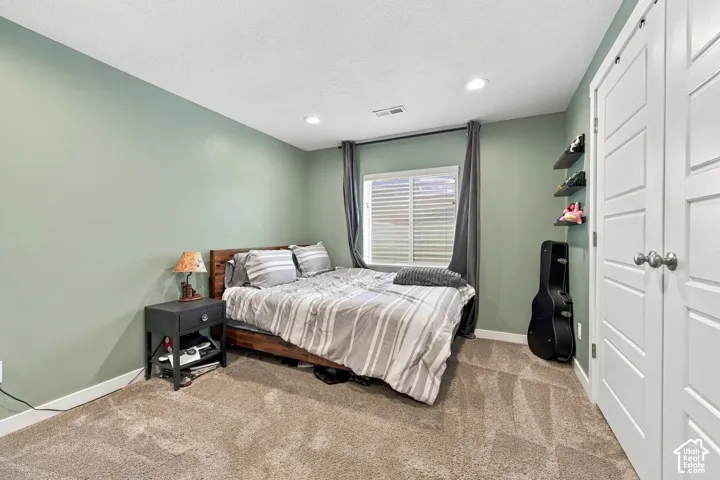 Bedroom 6 - Recessed ceiling lighting, textured wall finish, and a window with horizontal blinds