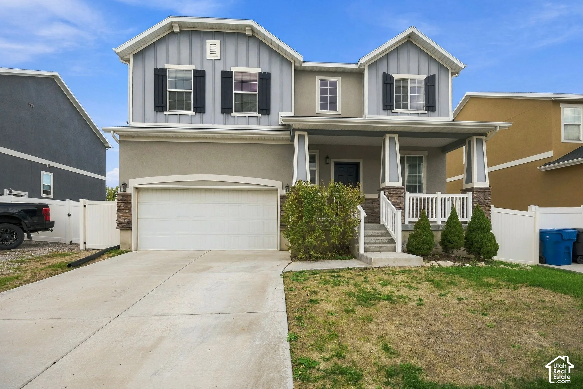 Two-story home with a covered front porch and a two-car garage