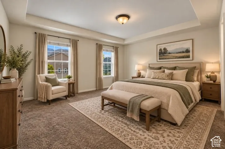 AI Staged Primary Bedroom featuring a tray ceiling, plush wall-to-wall carpeting, and dual windows
