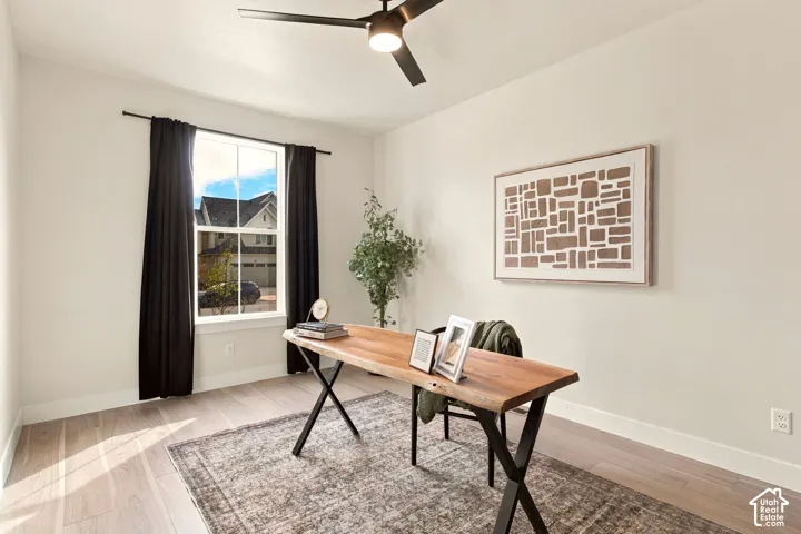 Recessed lighting, wood-finish flooring, and a modern ceiling fan