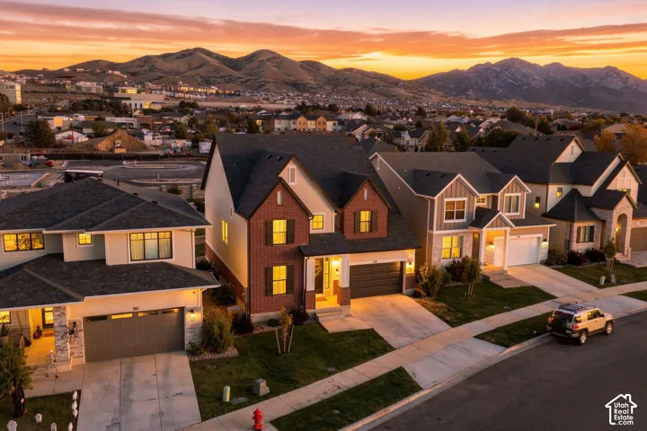 Modern residential architecture with varied exterior finishes including brick, siding, and stone accents