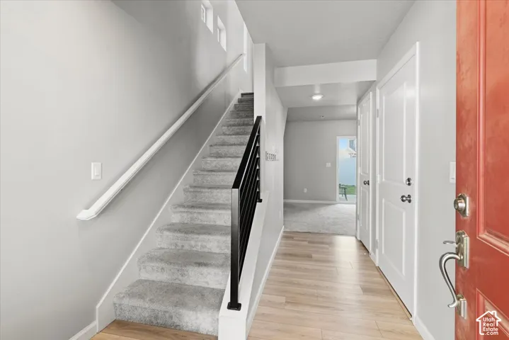 Bright entry with wood-finish flooring