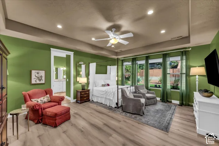 Recessed lighting, wood-finish flooring, ceiling fan, and multiple windows