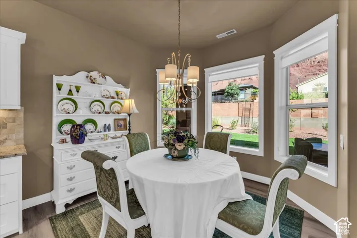 Neutral tone walls, wood-finish flooring, and white trim throughout