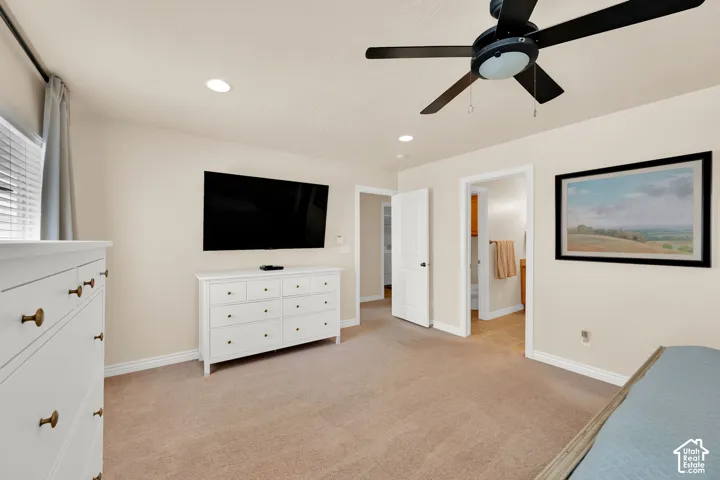 Neutral-toned walls, recessed lighting, and a ceiling fan with light fixture