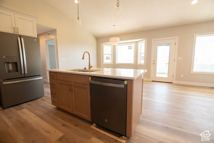 Kitchen island with an undermount sink and a brass-finish faucet