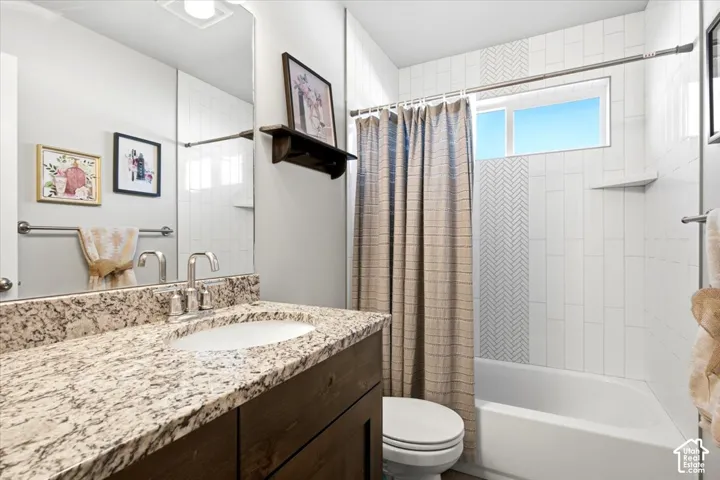 Vanity with stone countertop and undermount sink