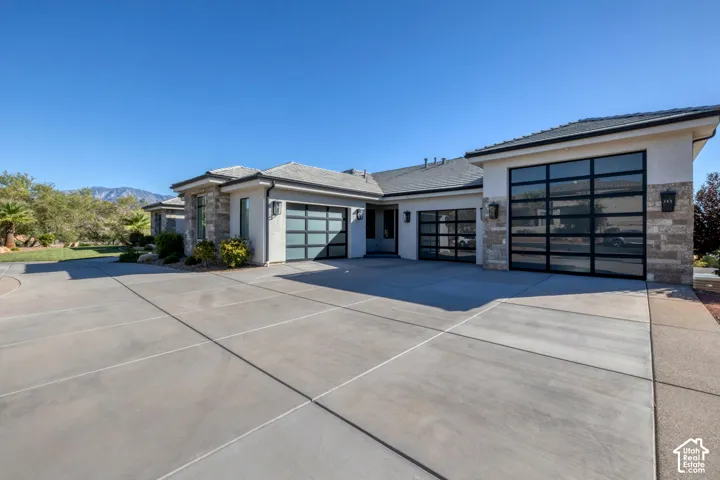 Contemporary exterior with stucco siding and stone accents