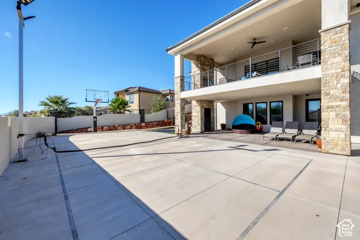 Spacious concrete pad with integrated basketball hoop and netting
