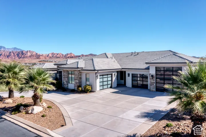 Modern exterior with stone accents and a tile roof