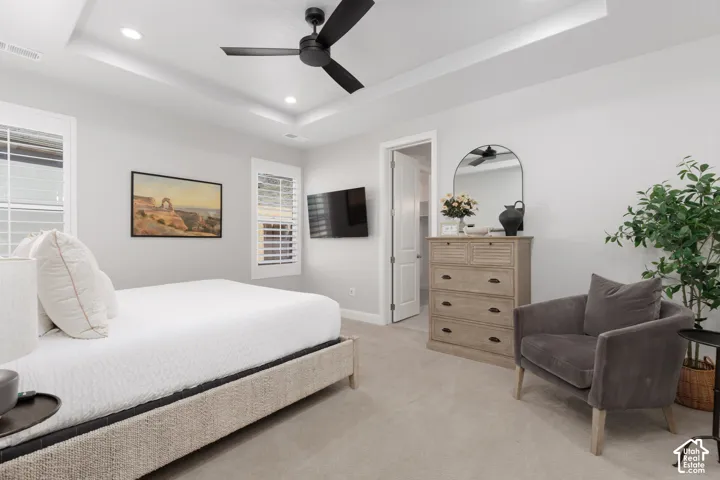 Tray ceiling with recessed lighting and a ceiling fan