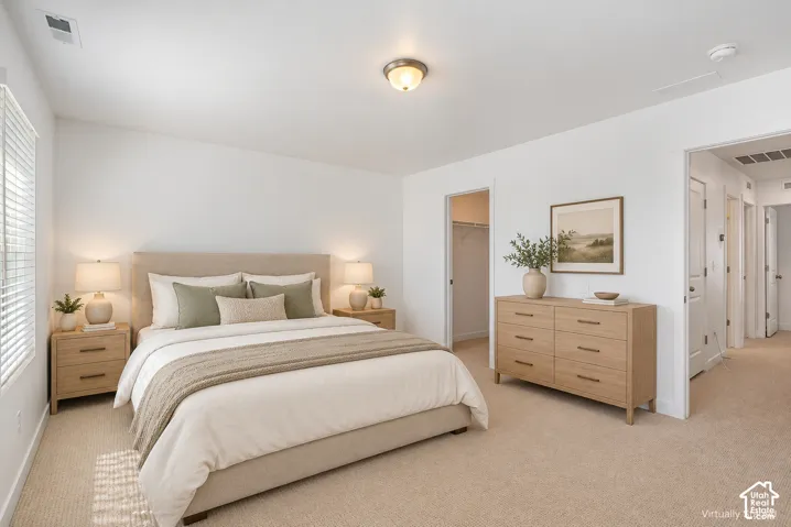 Carpeted room featuring a window with blinds, a built-in closet with shelving, a ceiling-mounted light fixture, and white painted walls