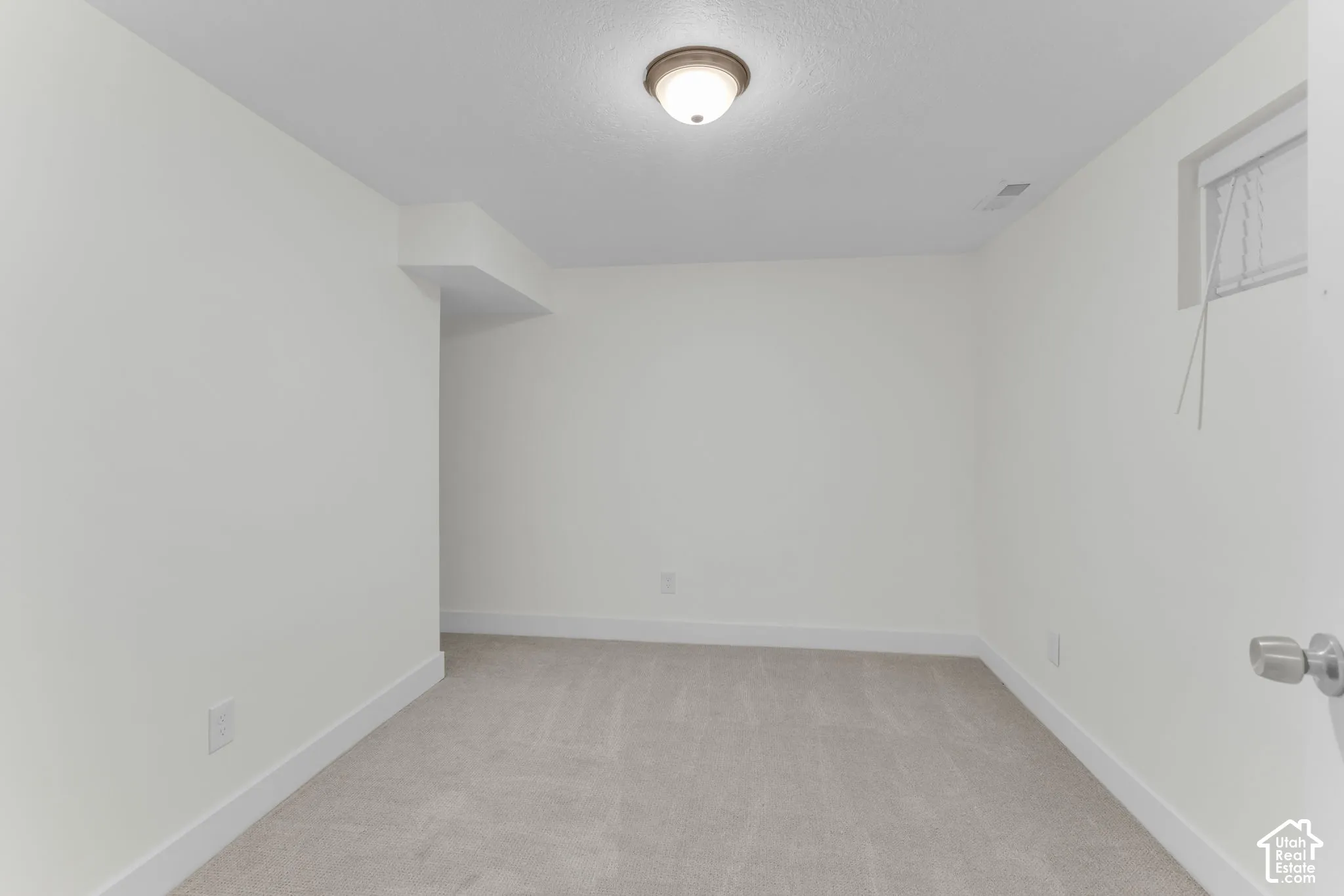 Neutral-toned wall-to-wall carpeting