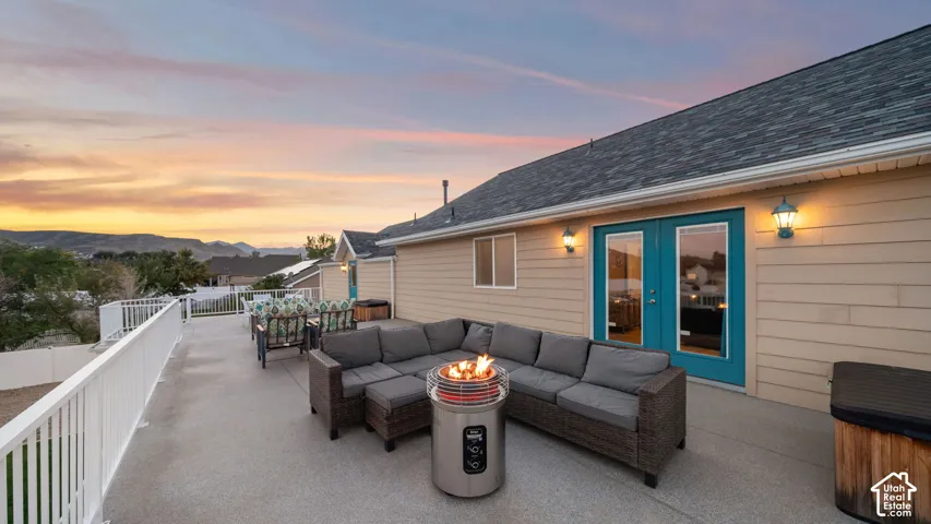 Expansive outdoor deck with a durable concrete surface and white railings