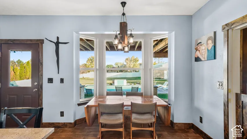 Bay window overlooking the outdoor pool and yard