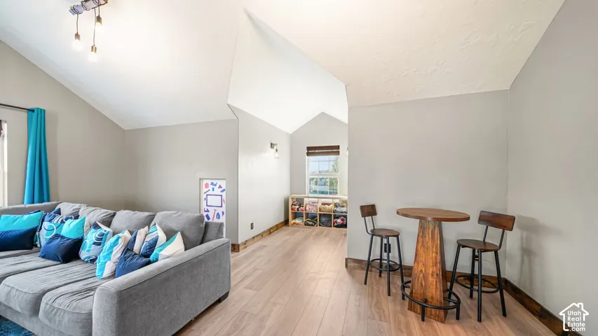 Vaulted ceilings with an exposed beam light fixture