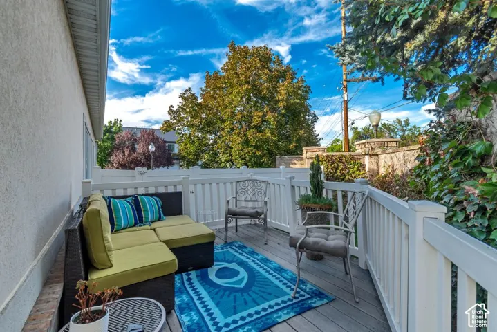Deck with white railing and privacy wall