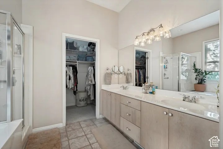 Dual vanity with white countertops and undermount sinks