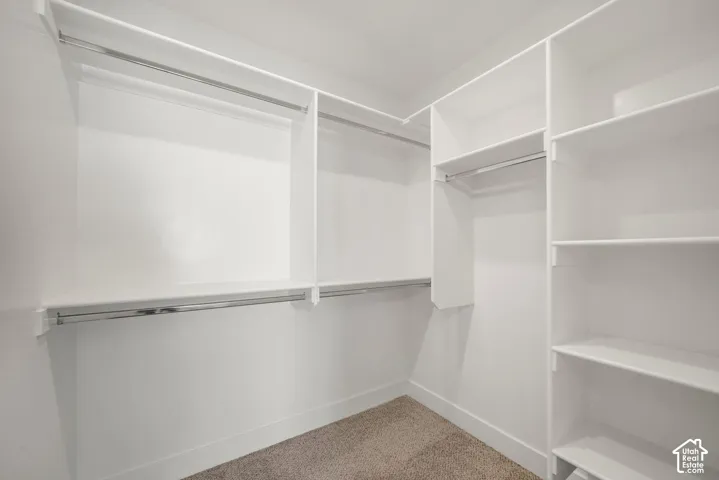 Built-in closet organization system featuring multiple shelves and hanging rods