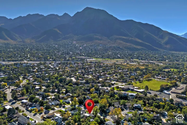 Mountain backdrop featuring a residential community with mature trees