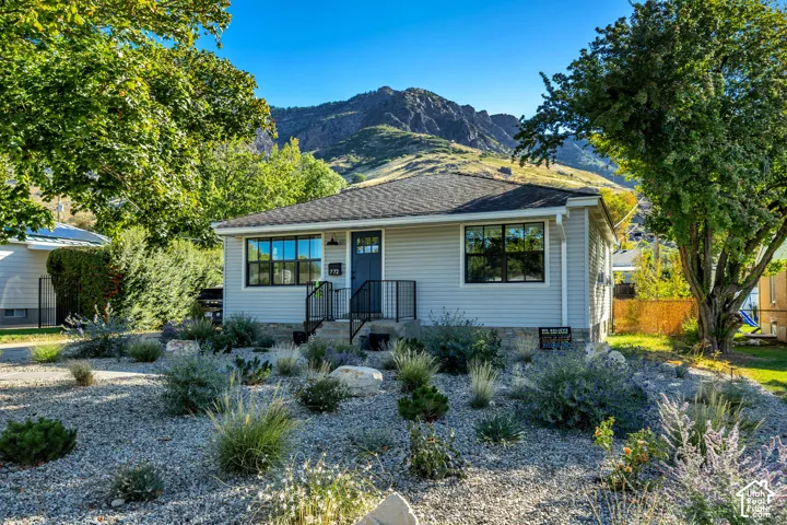 Light gray siding with dark trim windows