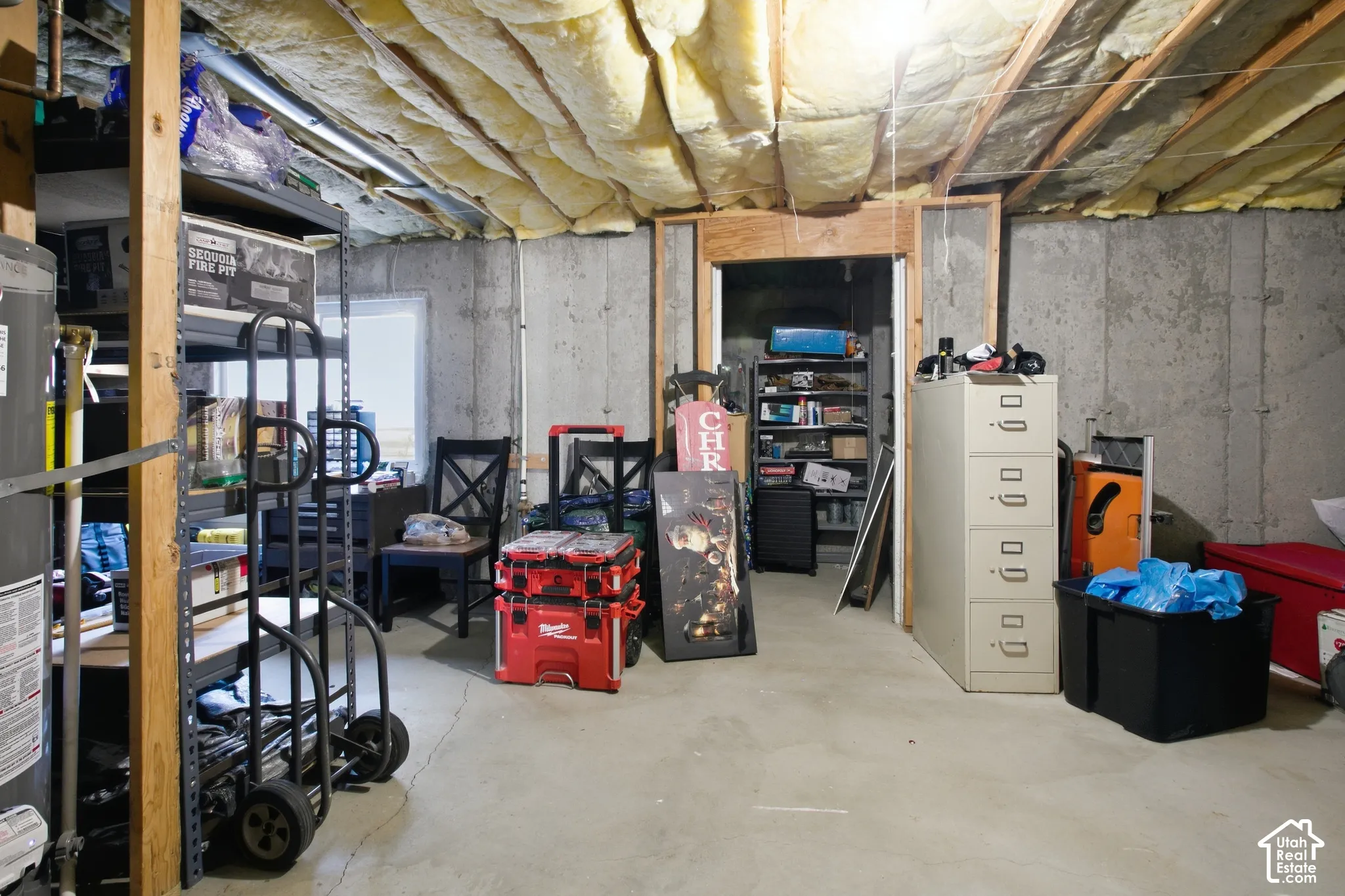 Concrete foundation walls with exposed wood framing and insulation
